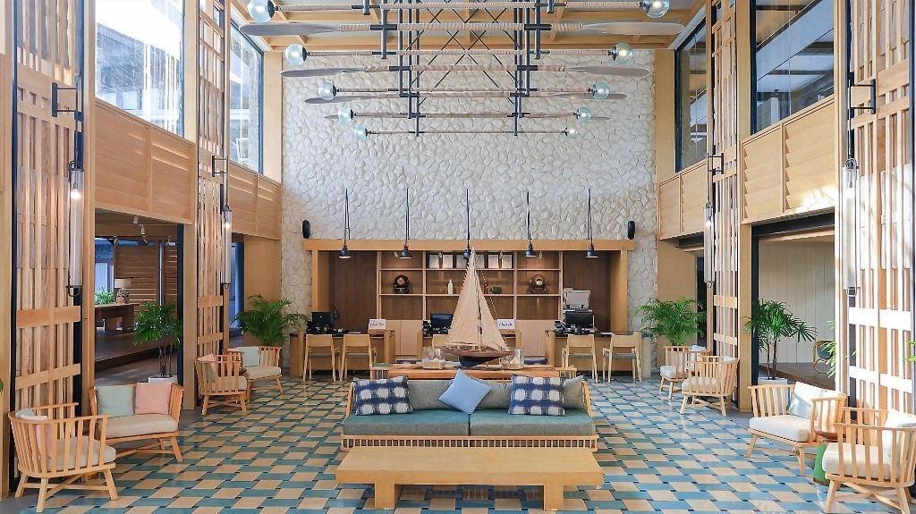 Seating in a tall lobby at Holiday Ao Nang Beach Resort