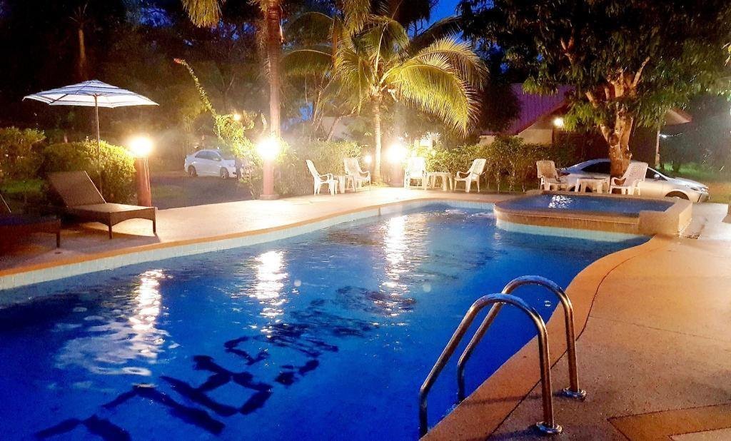 Pool illuminated at night at Mild Garden View Resort
