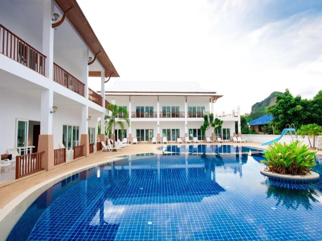 Pool surrounded by buildings at Nadivana Serviced Apartment