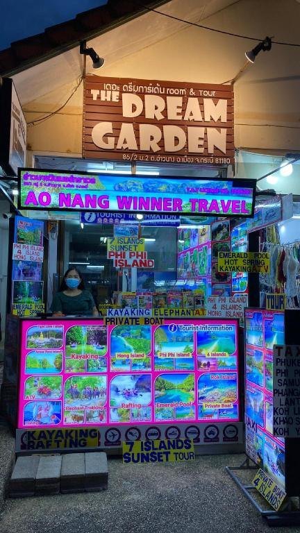 The Dream Garden entrance sign above a tour counter