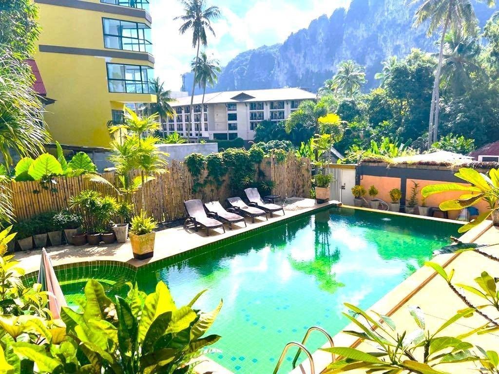 Pool and mountain backdrop at The Haleeva Aonang