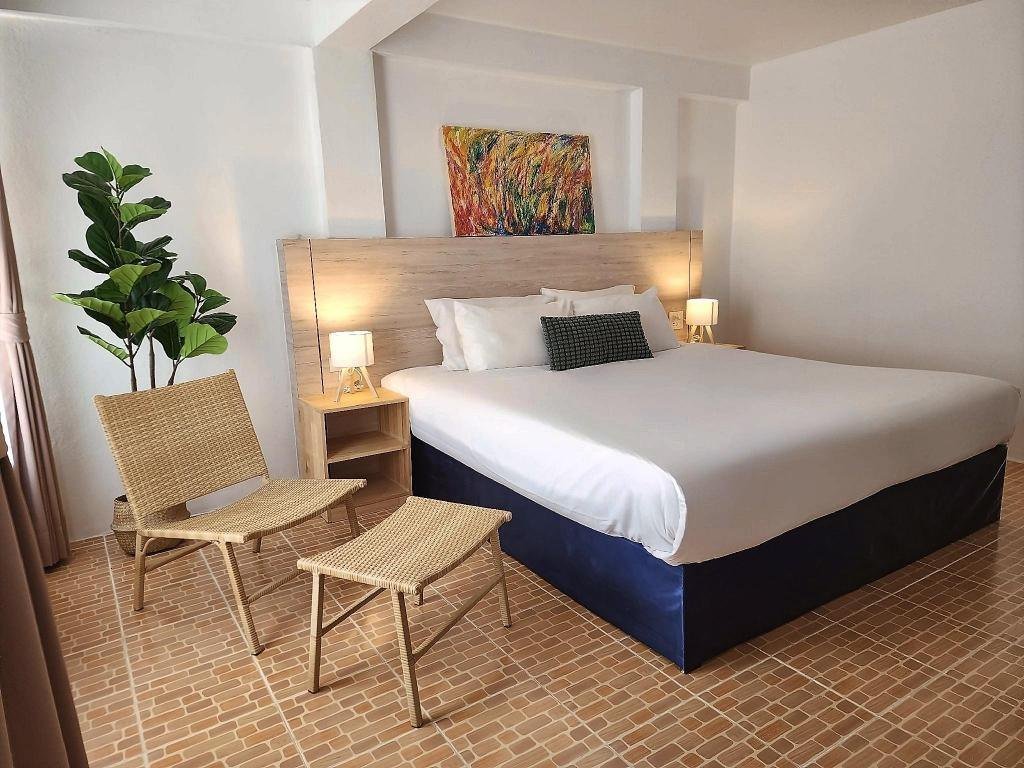 Bedroom with seating at The Palace Aonang Resort
